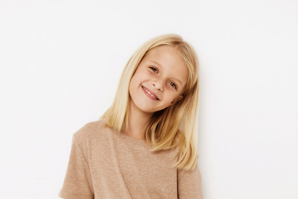 Child smiling before an orthodontic evaluation in Winnebago, IL