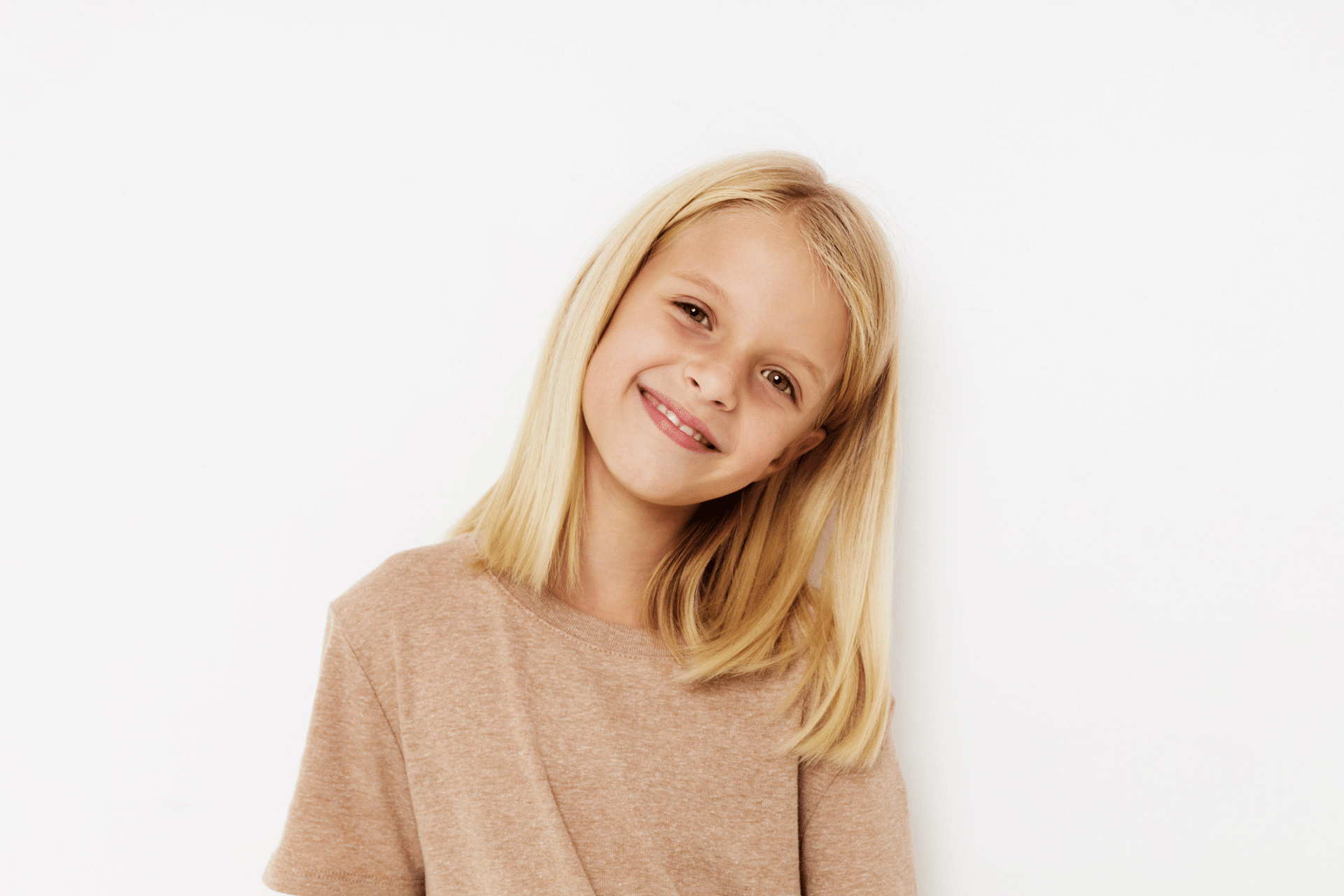 Child smiling before an orthodontic evaluation in Winnebago, IL